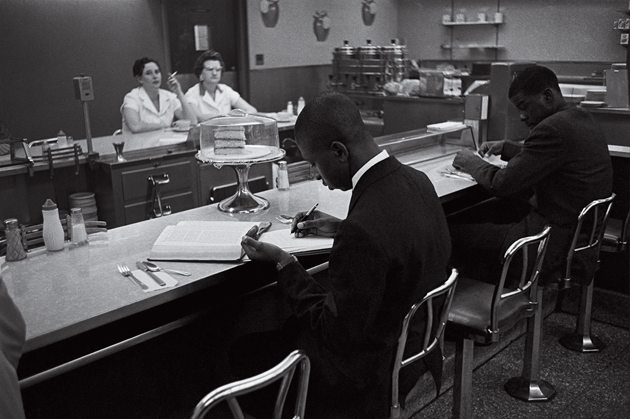 Students from Saint Augustine’s College study while participating in a sit-in at a lunch counter reserved for white customers in Raleigh, North Carolina, 1960 © Bettmann/CORBIS