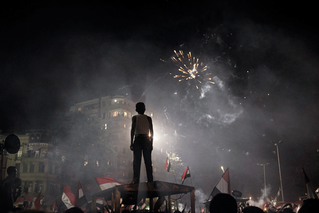 Fireworks light the sky after demonstrations turn to celebrations in and around Tahrir Square following Egyptian president Mohamed Morsi’s ouster and arrest by the military, July 3, 2013 © Yuri Kozyrev/NOOR