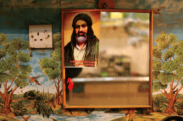 A devotional portrait of Ali, the first Shia Imam, in a shop, Kut, 2013