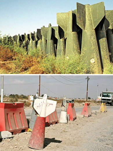 Bomb fins on the Iraqi air base at Kut in 2003 (above), and repurposed as traffic cones in 2013 (below)