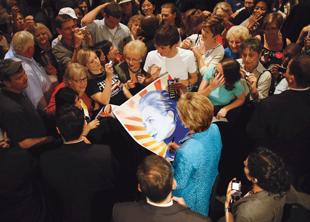 Hillary Clinton, then a senator, signs a poster during a 2008 presidential-campaign event at Wait Chapel on the Wake Forest University campus, in Winston-Salem, North Carolina © Joe Raedle/Getty Images