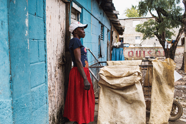 Madam Lebrun, a cane and charcoal seller, has lived in the D.R. for more than twenty years. Though two of her children were born in Santiago, they have never been issued identity papers, and her own passport is no longer valid. Photograph by Thomas Freteur.