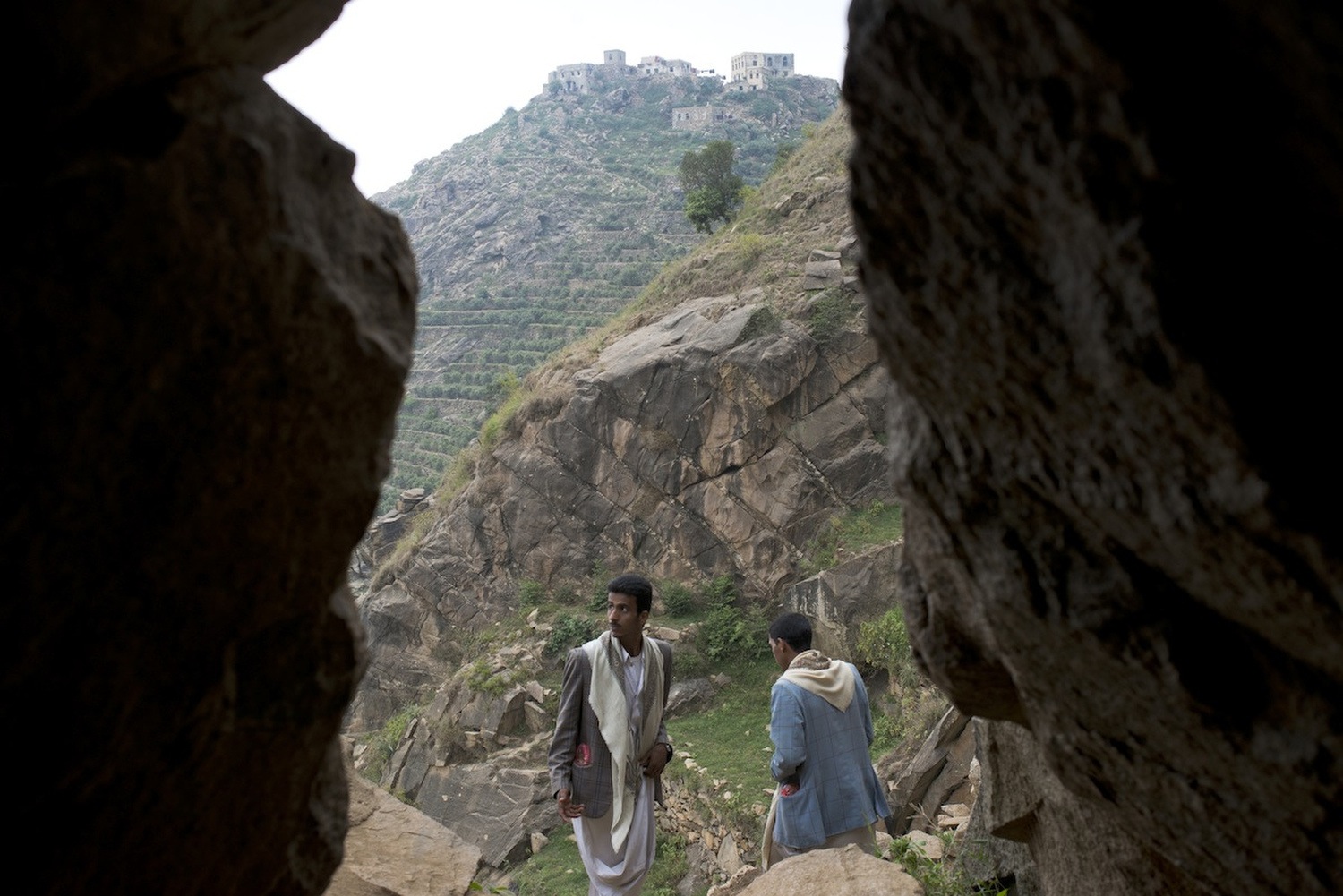 Yemeni men visit the pilgrimage site in the mountains of Marran, where Hussein Al Houthi was killed.
