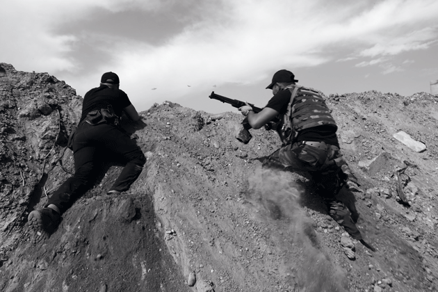 Hashd al-Shaabi militia members on the front line, Baiji