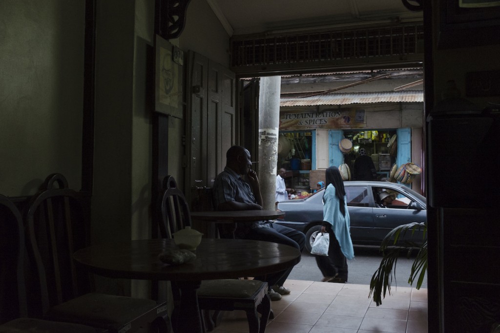 A man rests in a cafe in Mombasa's Old Town.