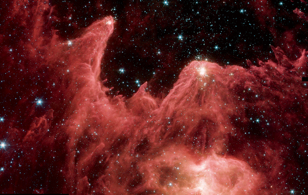 A false-color image of the Cassiopeia constellation, taken by NASA’s Spitzer Space Telescope. The mountainous pillars are where stars are born. Courtesy NASA/JPL-Caltech/Harvard-Smithsonian/ CfA/ESA/STScl.