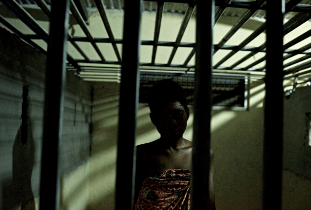 A patient in the restraint home at Edumfa, where those considered violent or at risk of running away are caged