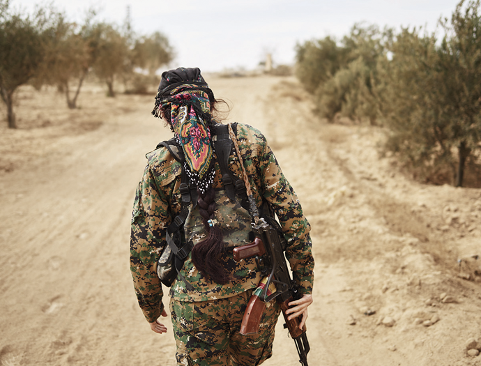 Commander Rojda Felat leads her YPJ unit toward a frontline position, Syria, November 2016.