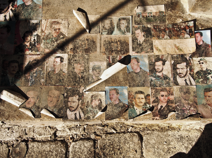 Photographs of the Assad family, on a wall in Aleppo, March 2013 © Moises Saman/Magnum Photos