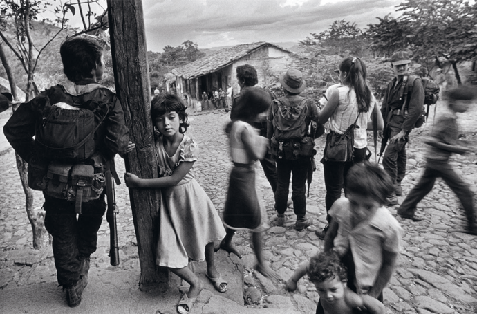 Children and insurgents in rebel-held territory, San José Las Flores, Chalatenango, El Salvador, 1988 © Donna De Cesare