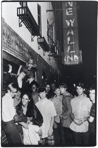 Celebrating outside the boarded-up Stonewall Inn after the riots, 1969. Photograph by Fred W. McDarrah. From Pride: Photographs After Stonewall, published in May by OR Books