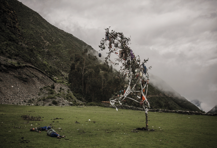 Two children play by a tree decorated for a carnival, in the district of Chungui, Ayacucho, February 2010. As exhumations of the bodies of those killed in the conflict continued, people in the region worked to revive traditional celebrations. © Max Cabello Orcasitas
