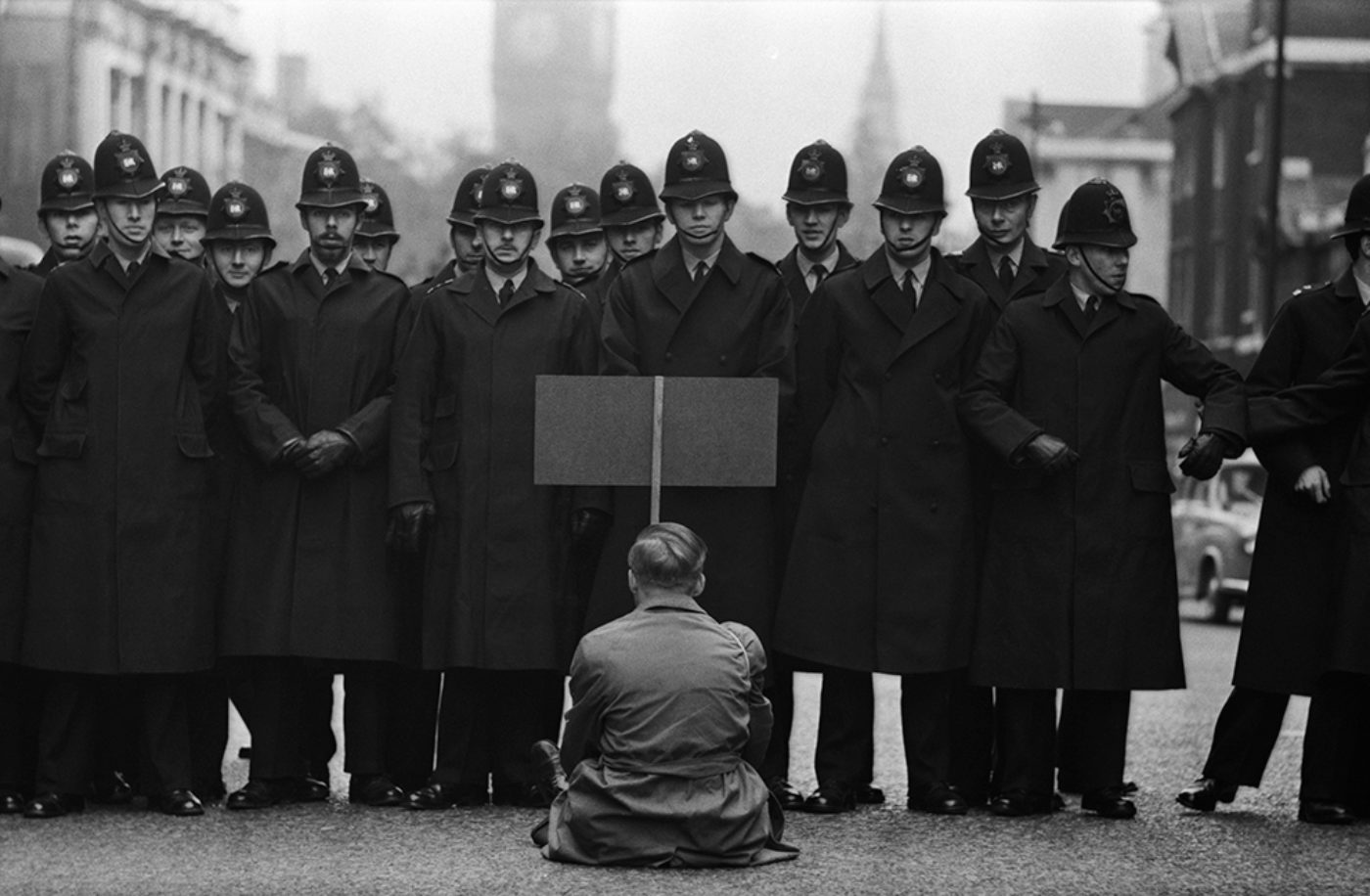 https://harpers.org/wp-content/uploads/2019/09/Protester-Cuban-Missile-Crisis-Whitehall-London-1963-Don-McCullin-1400x0-c-default.jpg