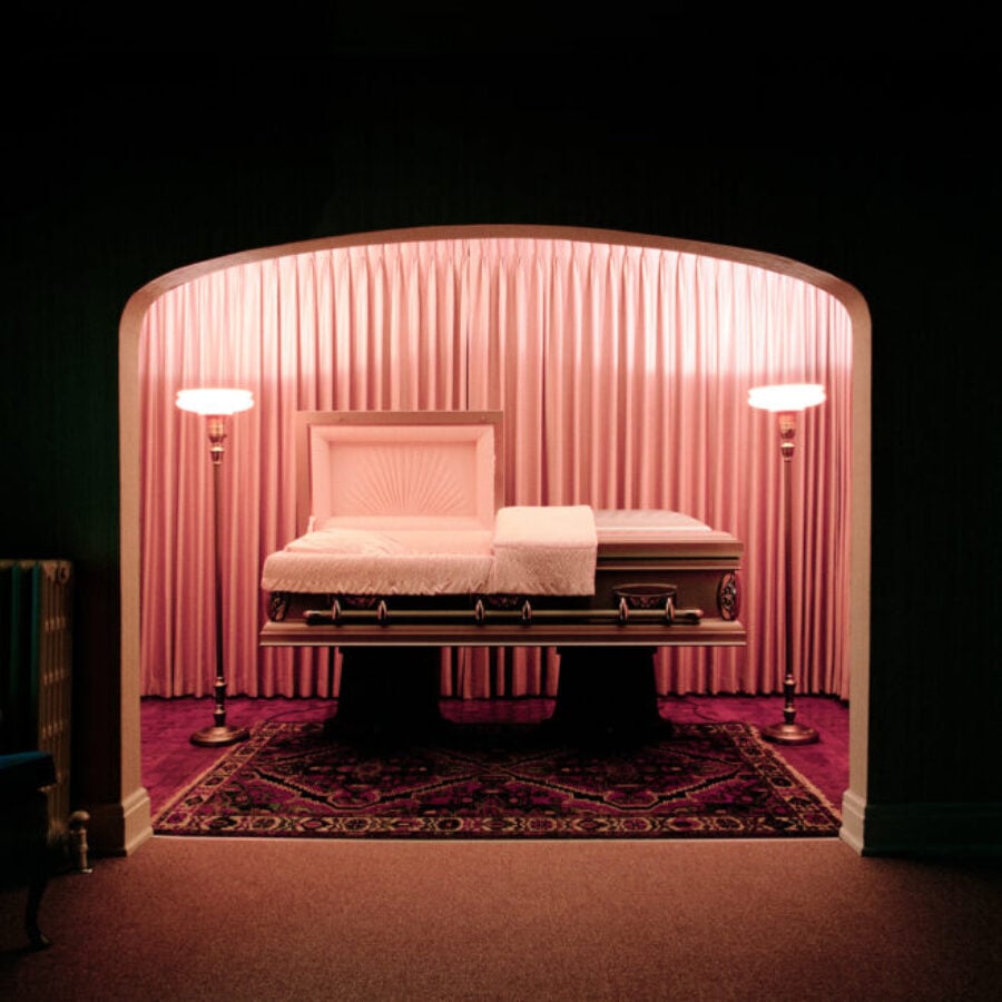 “Casket Showroom, Carter Funeral Home, Syracuse, NY, 1986,” by Lucinda Devlin © The artist
