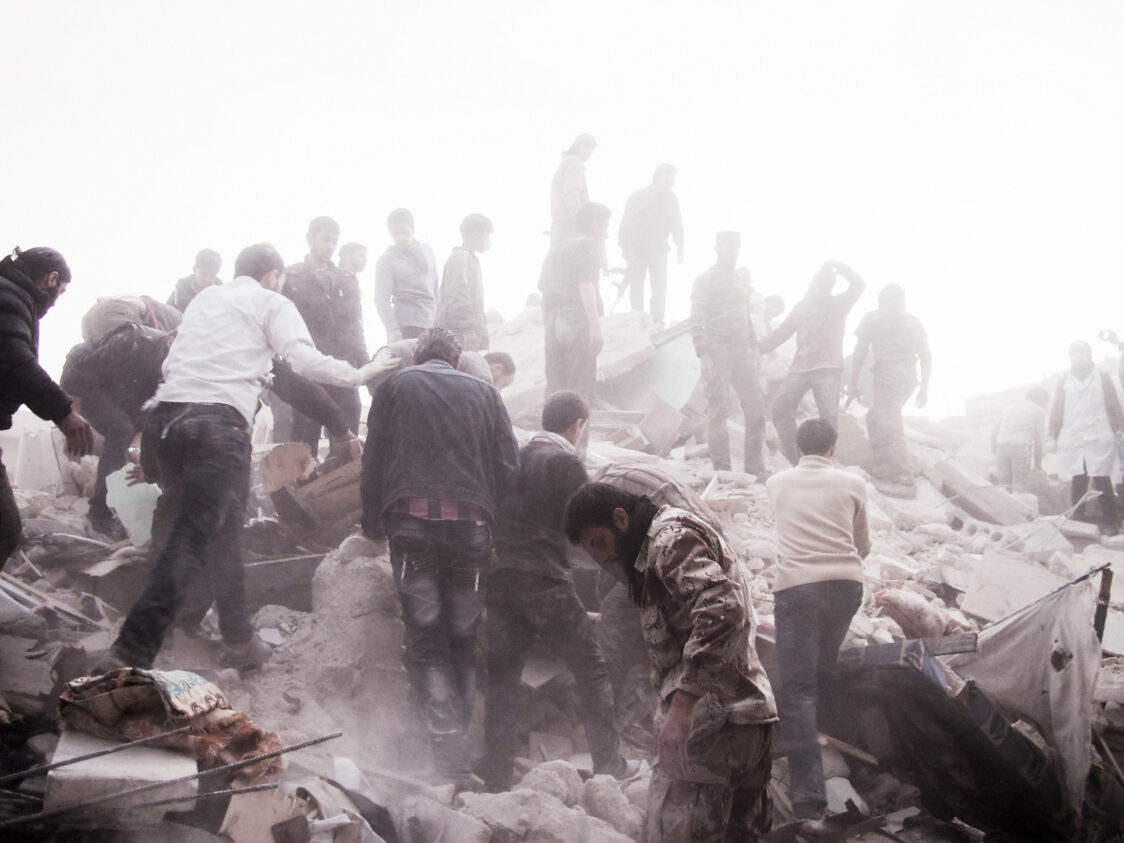 People search for survivors in the rubble of a residential building, Aleppo, March 2013 © Moises Saman/Magnum Photos